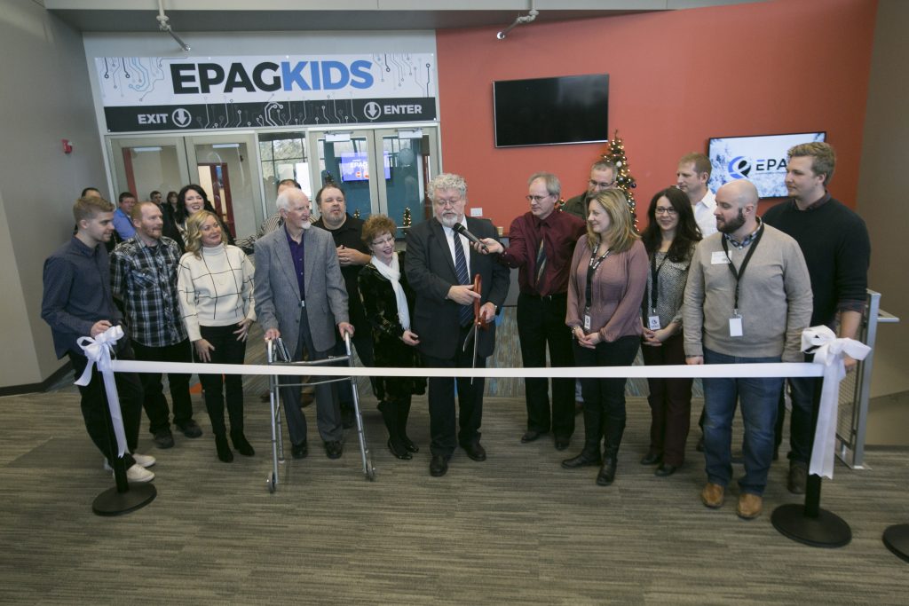 Group of people at a ribbon cutting